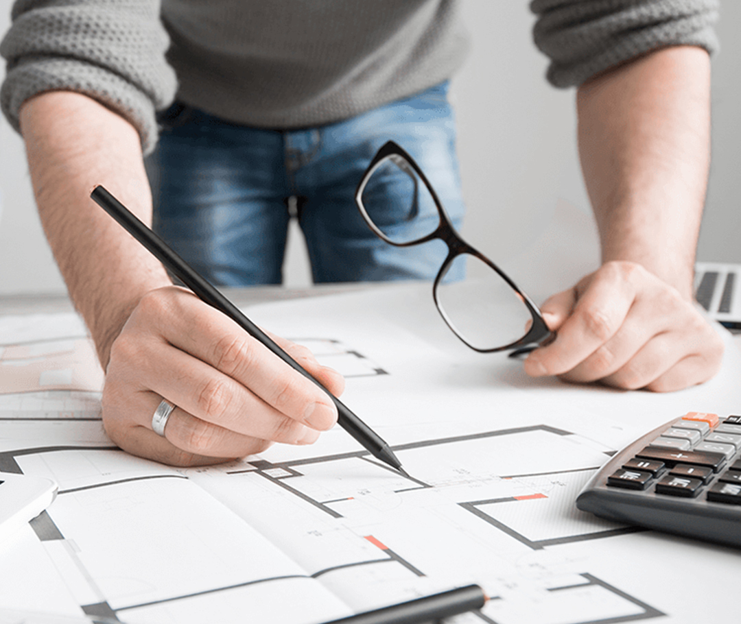 a man looking over custom home design for consultation