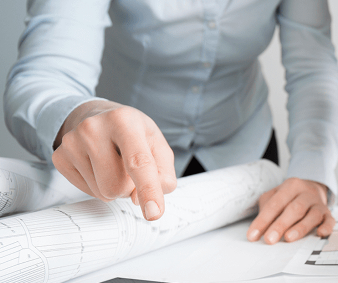 engineer pointing the house design on the paper