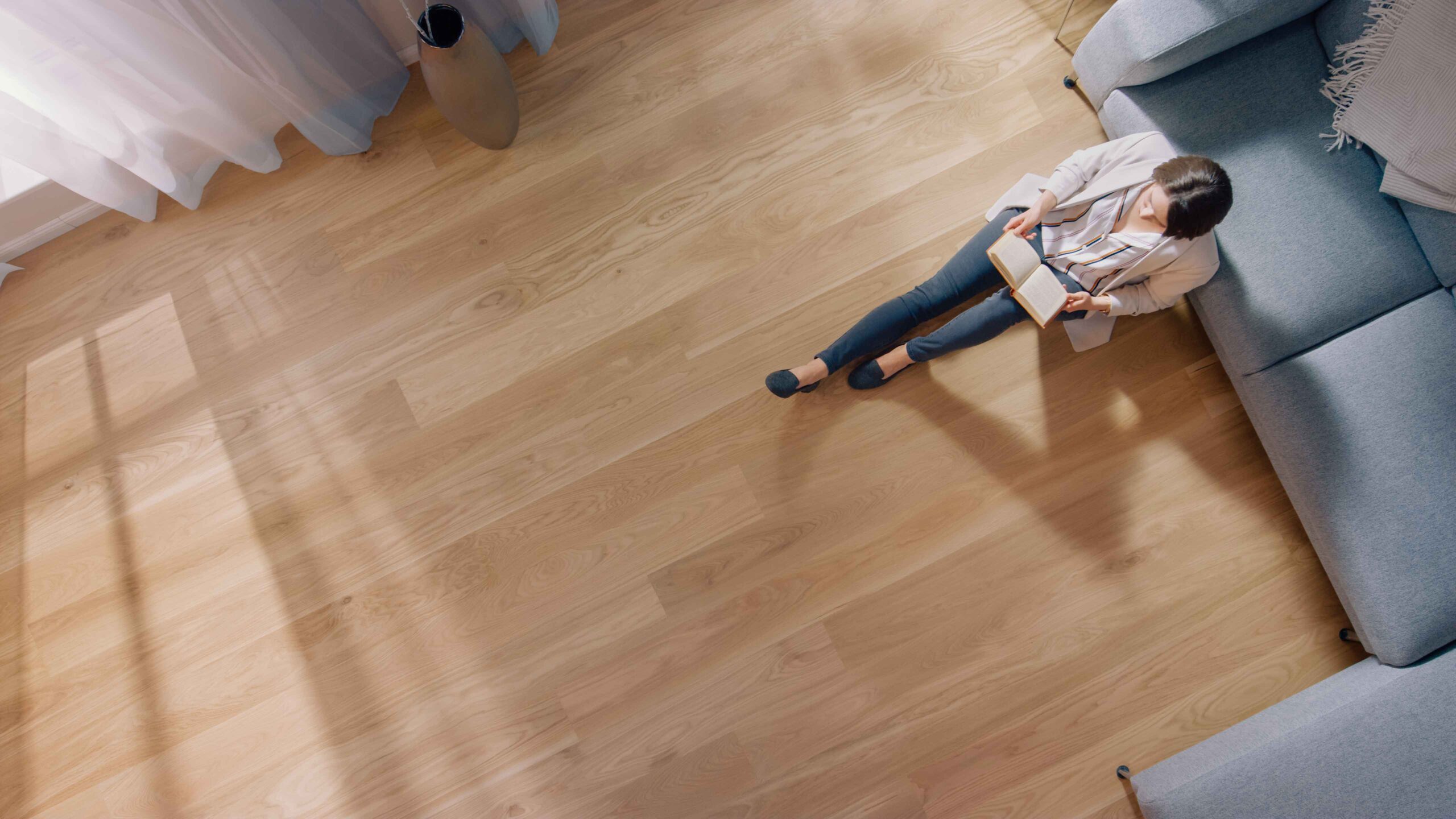 a woman admirning the new flooring in her new home